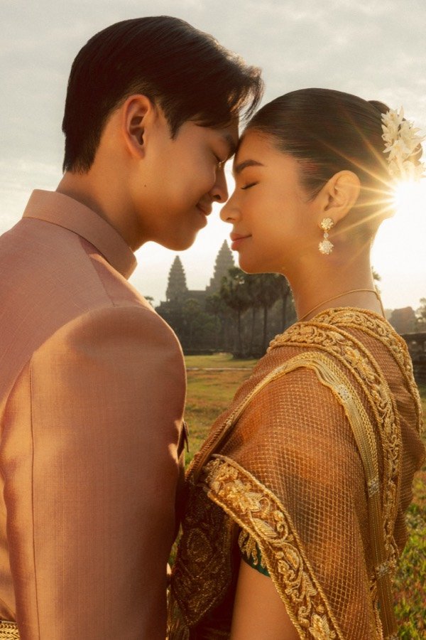 Vireak and Mony embracing at Angkor Wat at golden hour
